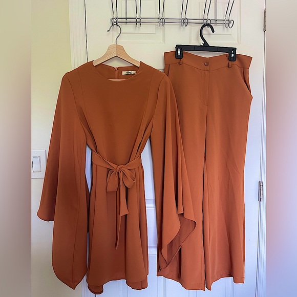 Orange and white colored suits with belts. - Picture 1 of 7